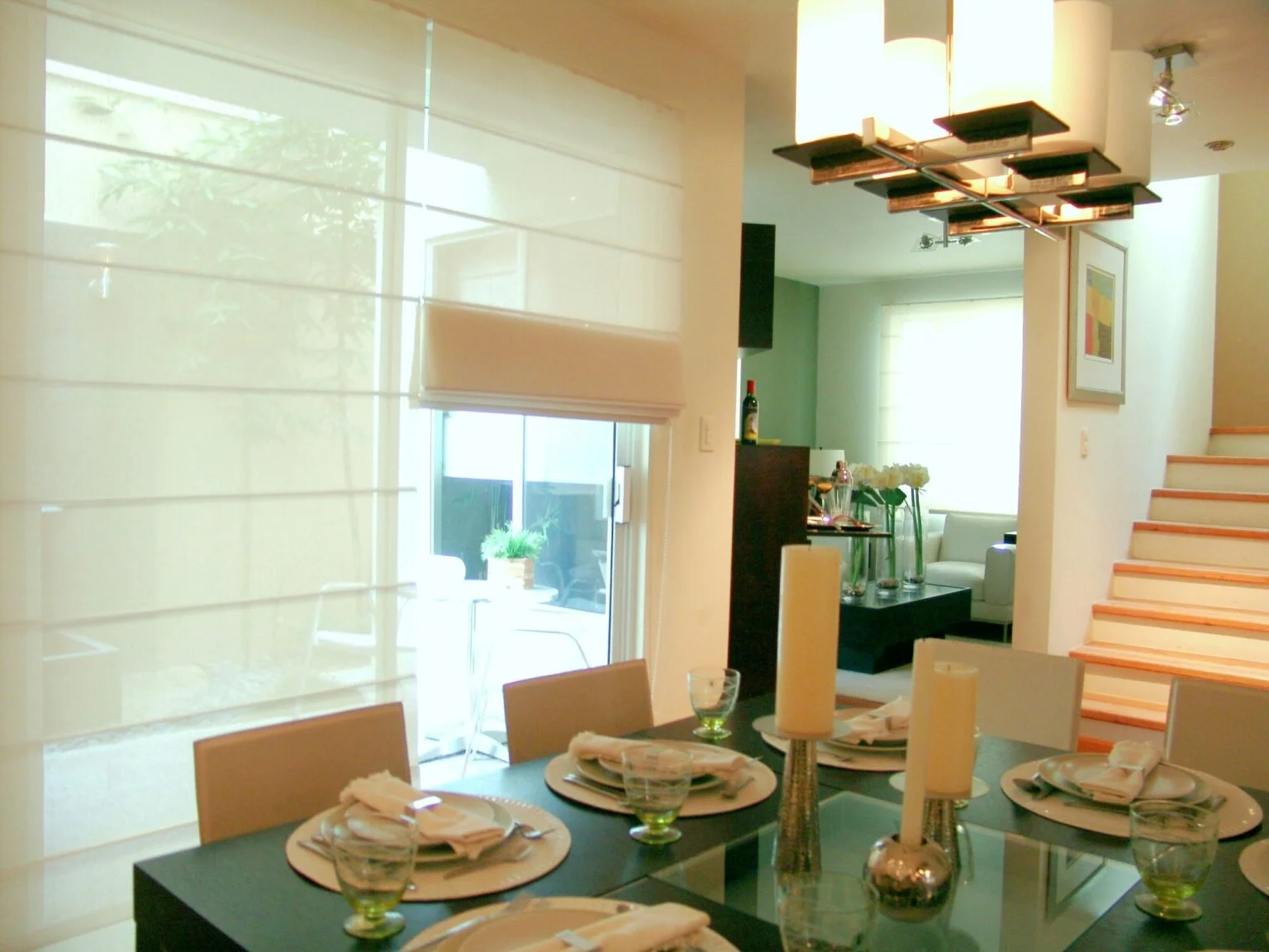 Soft Roman shades in a cozy dining nook