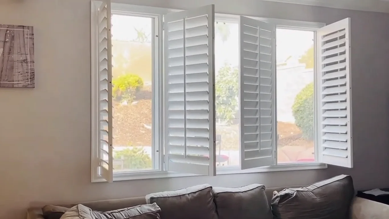 Custom interior shutters installed in a bright living room